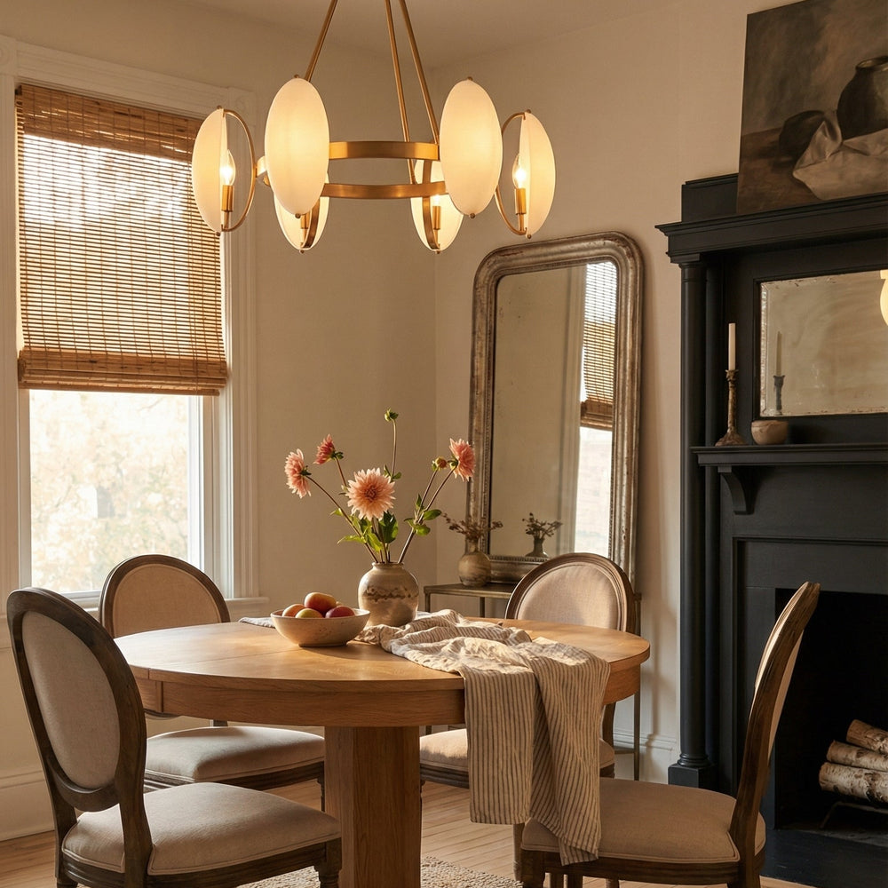 Dining room with wooden table and chairs, chandelier, and fireplace.