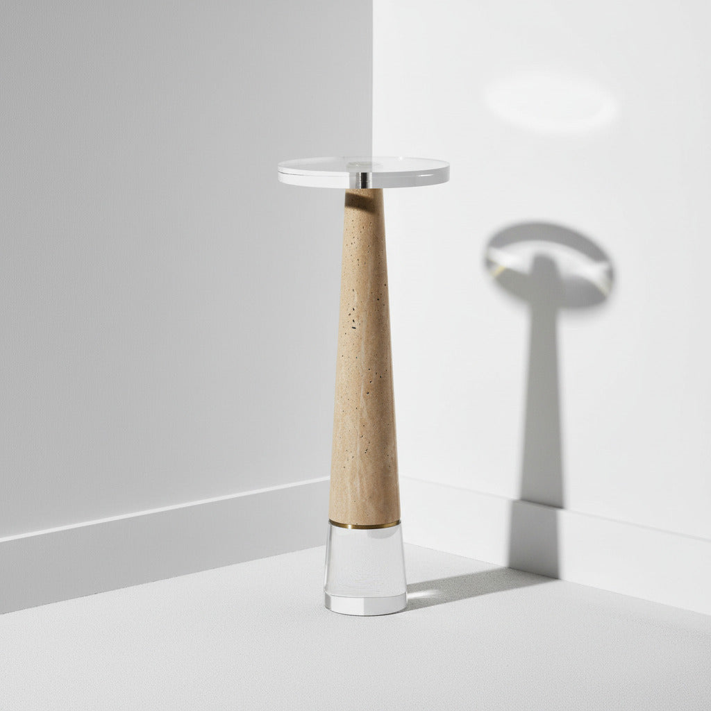 Coastal drink table lamp with a travertine base and white shade on a light gray background.