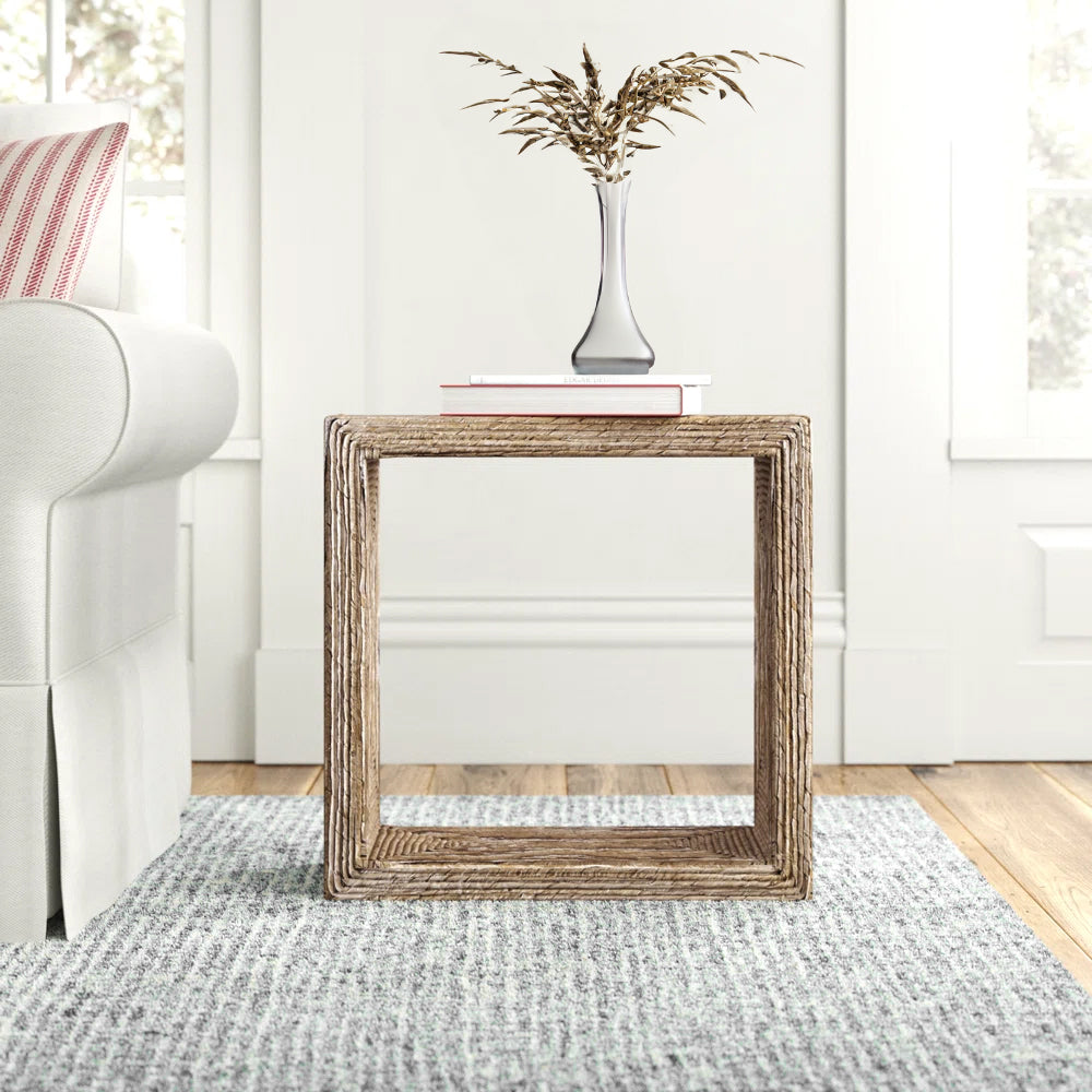 Coastal end table woven in rattan in a living room.