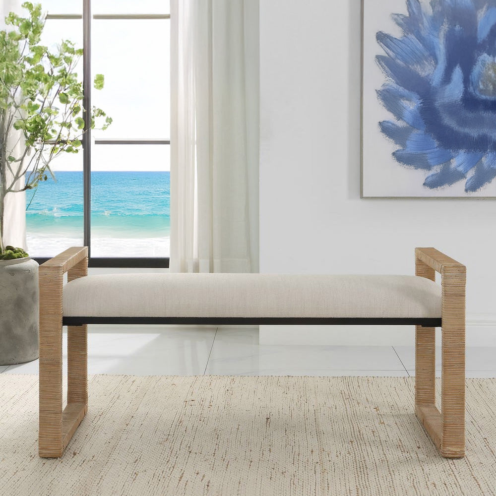 Coastal Entryway Bench Upholstered with Rattan Arms and Legs with Beach View.