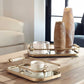 Gold Coastal Trays on Wooden Coffee Table.