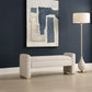 Modern Accent Bench in White Boucle Fabric with Abstract Art above and white coastal floor lamp.