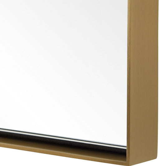 Decorative mirror on a wall above a console table with a plant and box.