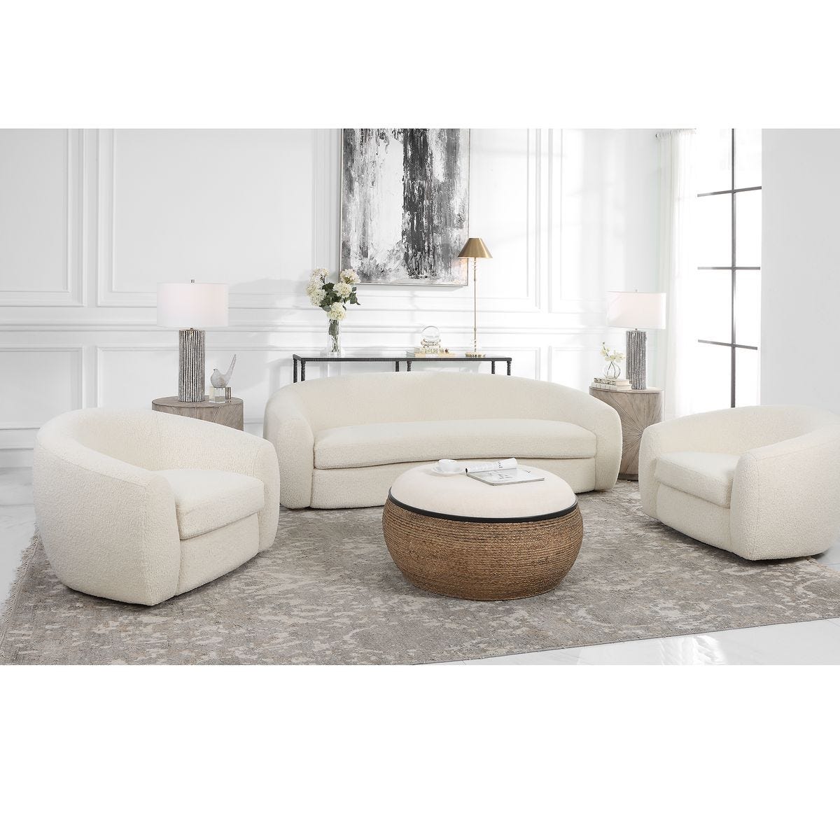 Modern living room with cream-colored sofa and chairs on a gray rug.