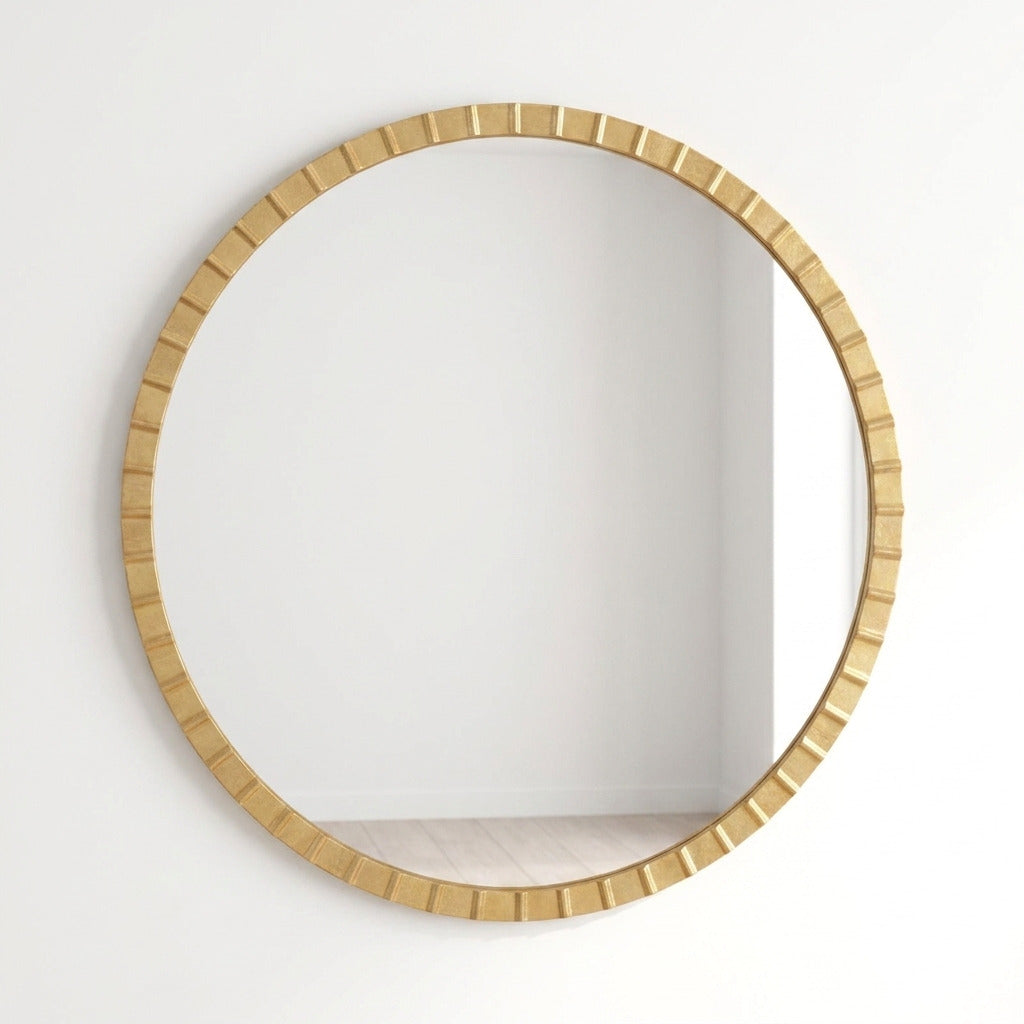 Round wall mirror with a textured, segmented gold-toned frame, mounted on a plain white wall.