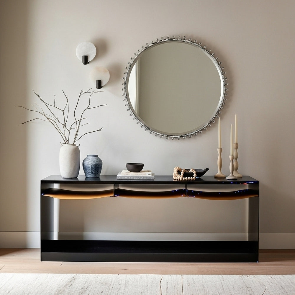 Modern console table with decorative items against a neutral wall