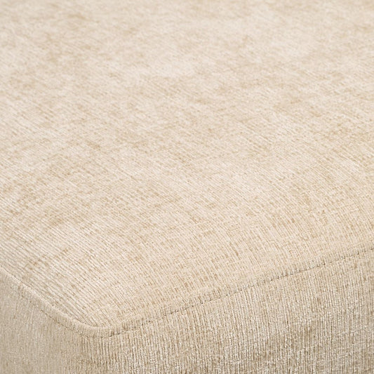 Beige upholstered chair with wooden legs on a neutral background