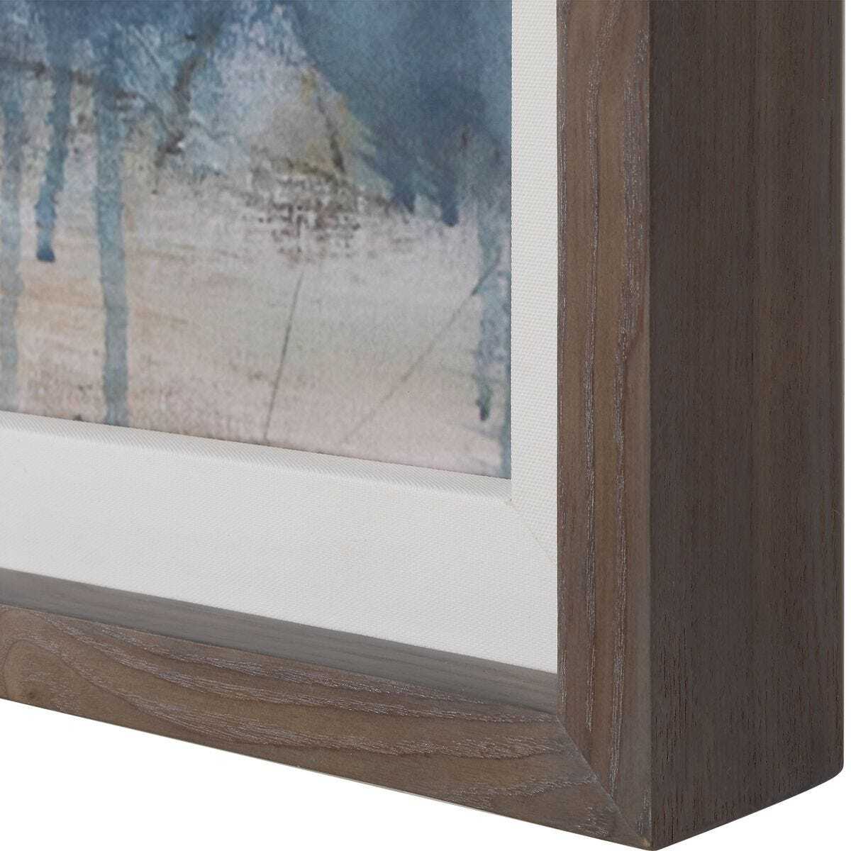 Close-up of a wooden picture frame with a textured surface.