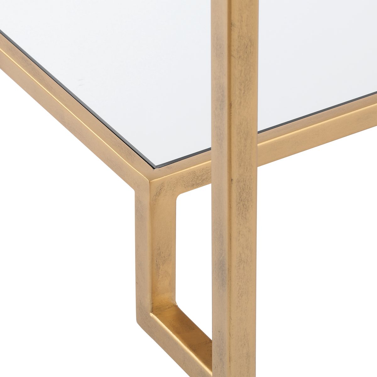 Glass table with gold metal frame on a white background