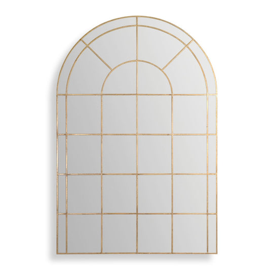 Decorative wall mirror with gold frame in a room with framed pictures on the wall.