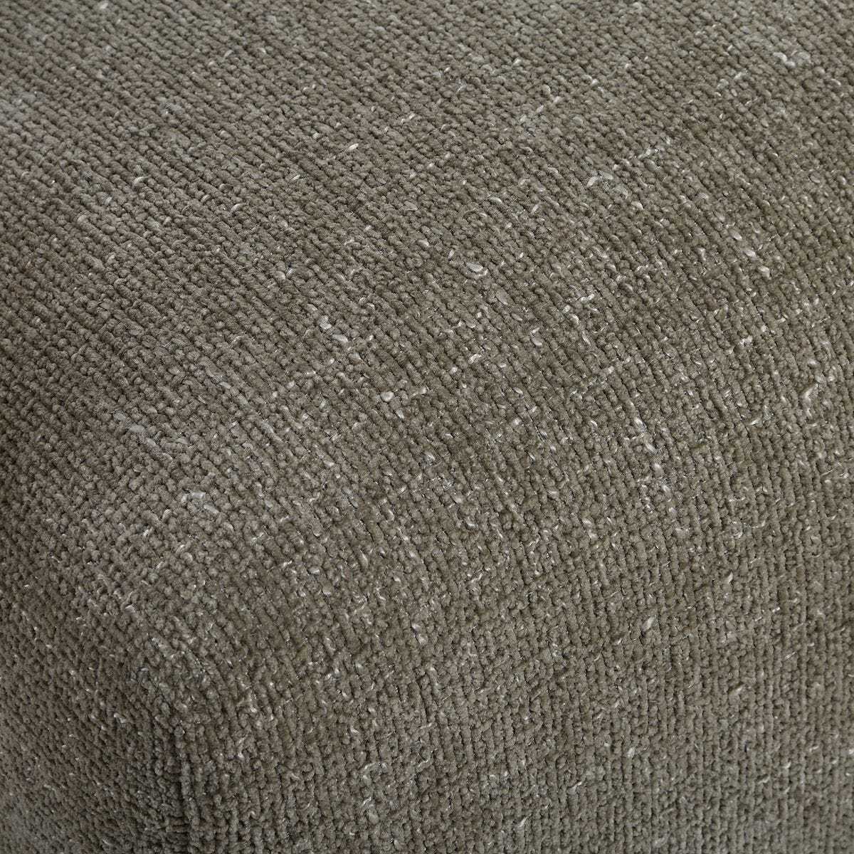 Close-up of a textured brown fabric surface