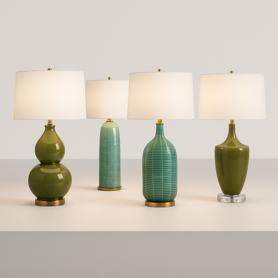 Set of four green ceramic table lamps with white lampshades on a light gray background