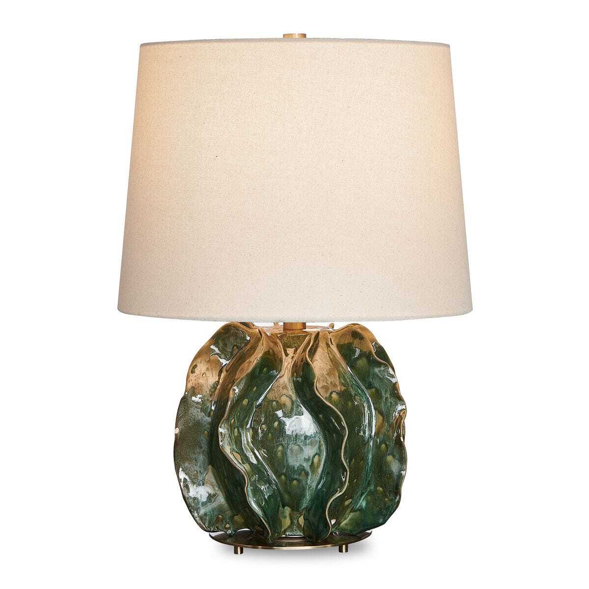 Decorative table lamp with a green ceramic base and beige lampshade on a white background