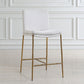 Sleek white boucle counter steel with aged gold metal frame set against a counter.