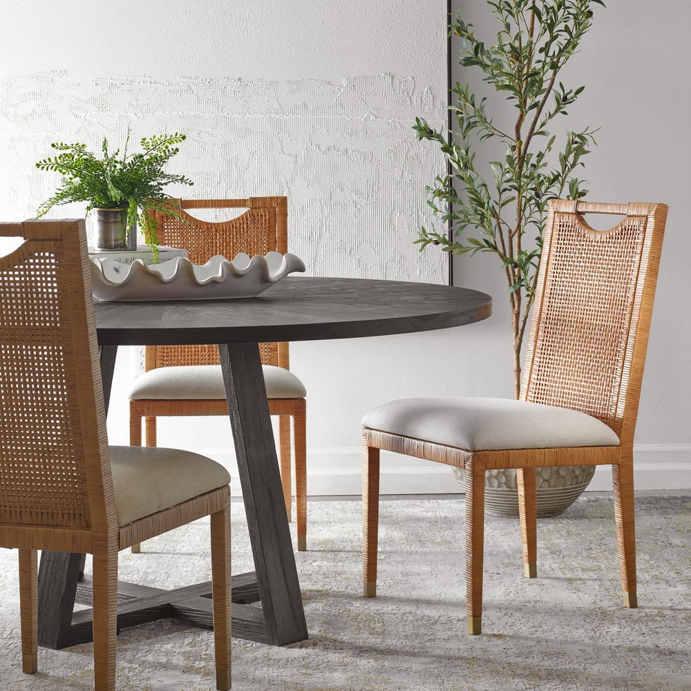 contemporary rattan dining chair set next to round dining table