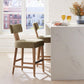 Moss green wood framed counter stools setting at kitchen counter.