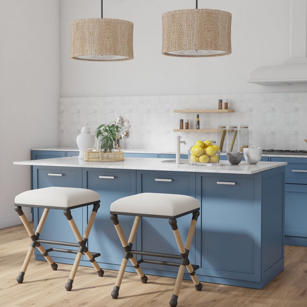 Kitchen counter setting with counter stools. The counter stools are charming l combining the rustic appeal of iron with the natural texture of rope, creating a unique and stylish piece for your home. The iron frame provides a sturdy foundation, while the rope accents add a touch of nautical flair. The cushioned top is upholstered in a soft and durable oatmeal cotton blend fabric, offering both comfort and style.