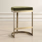 A  Brushed Brass Counter Stool with a Moss Green Velvet Seat. Hand Forged Iron Base