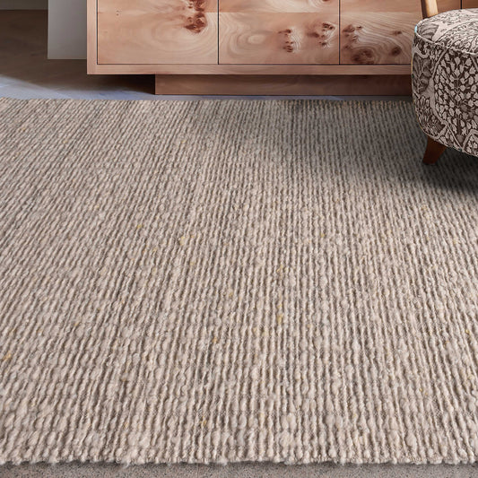 Ivory area rug in living room.