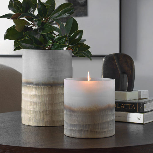 Japandi textured vases that are gold and beige on a coffee table in a living room.