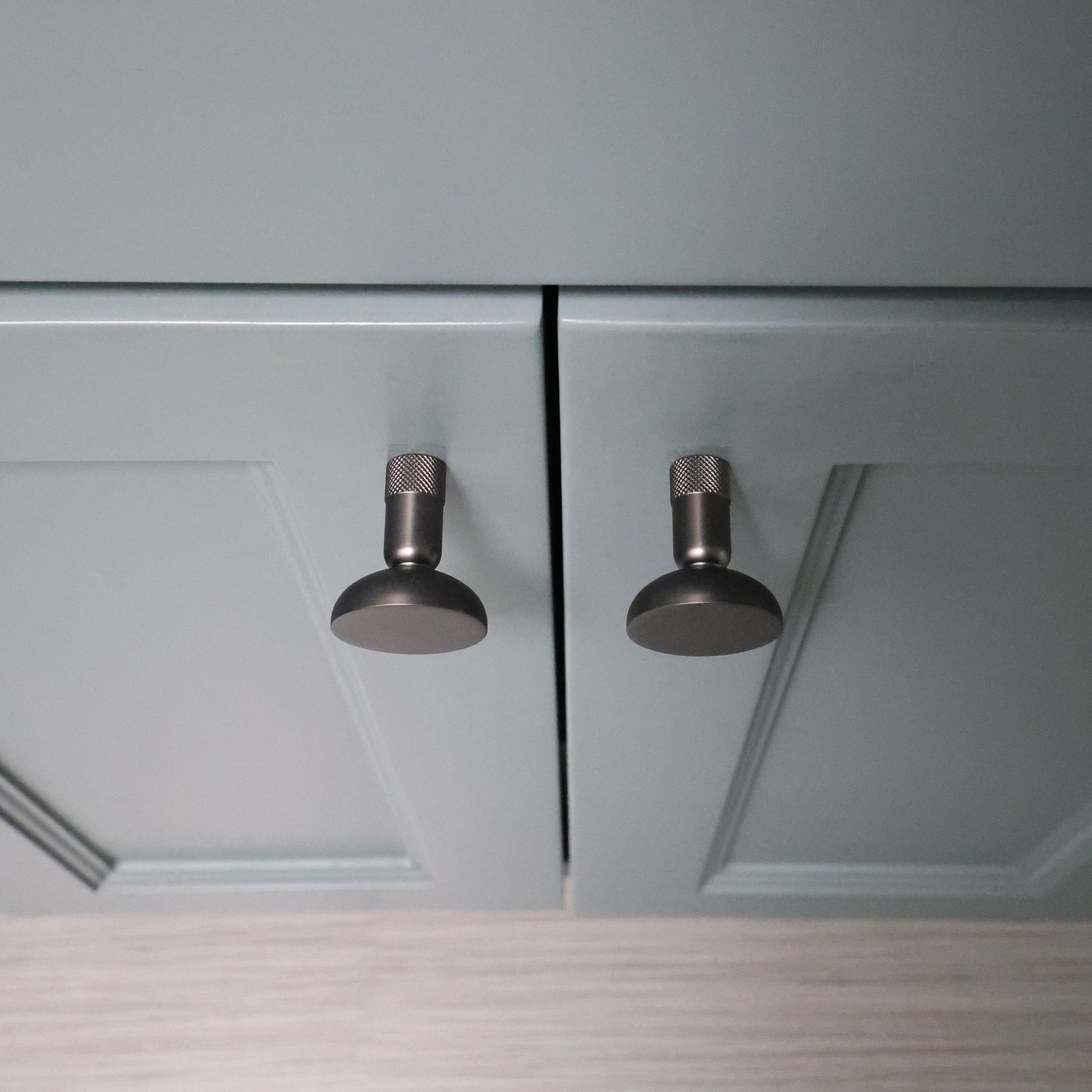 Graphite Cabinet Knobs on Blue Doors.
