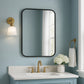Bathroom Vanity mirror on blue Wall.