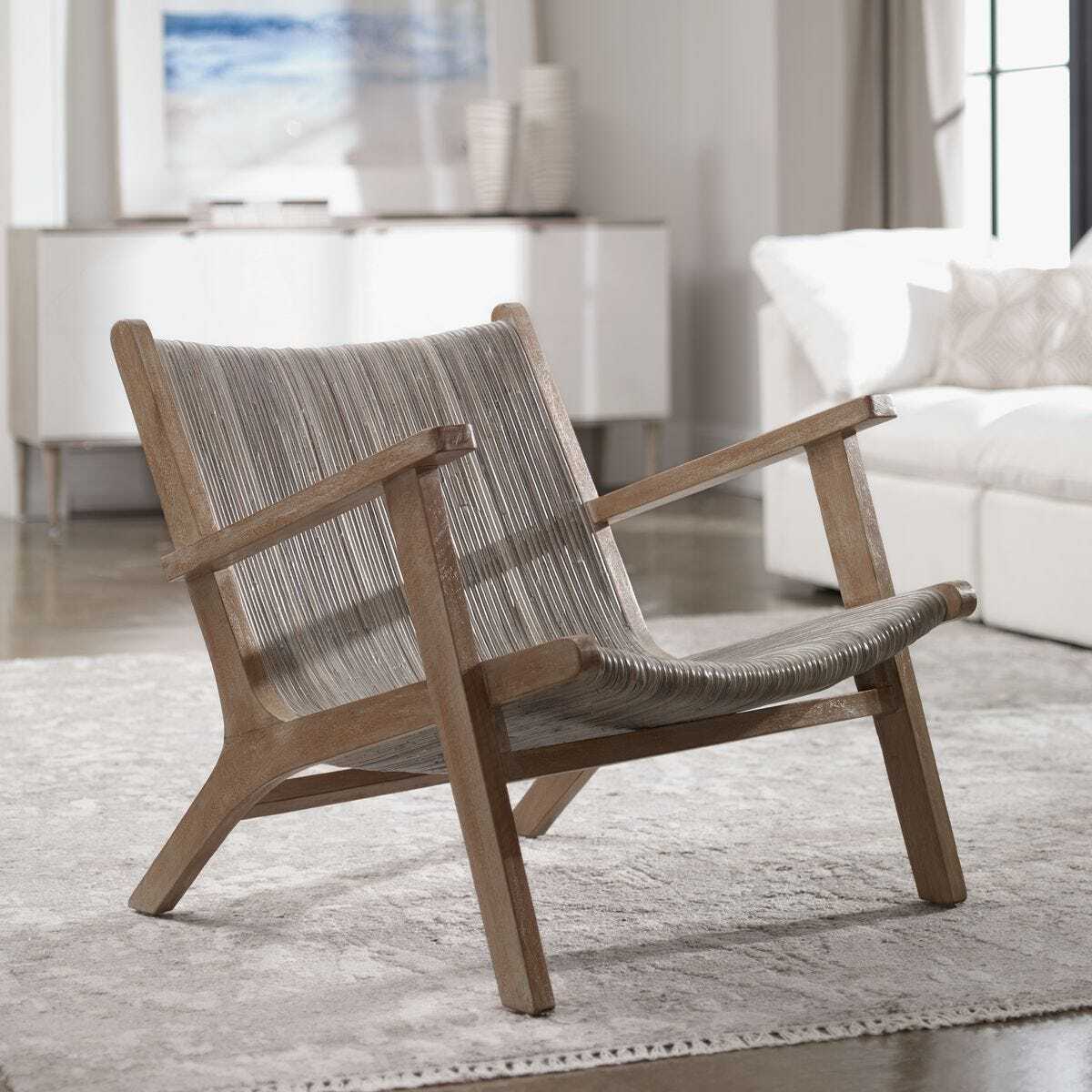 Wooden armchair with woven backrest in a living room setting