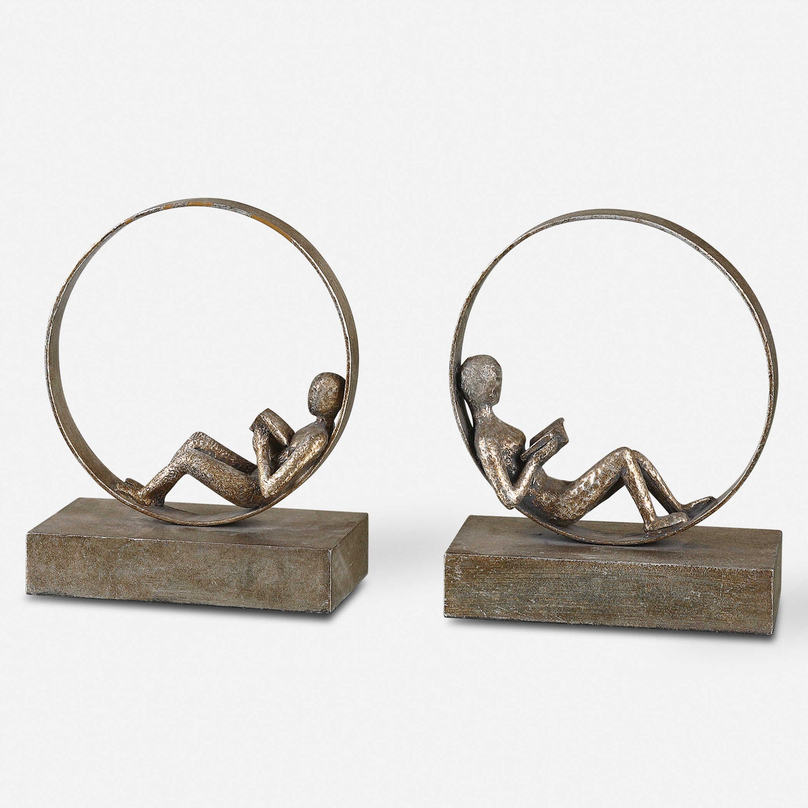 Two guys in bookends sculpture reading.