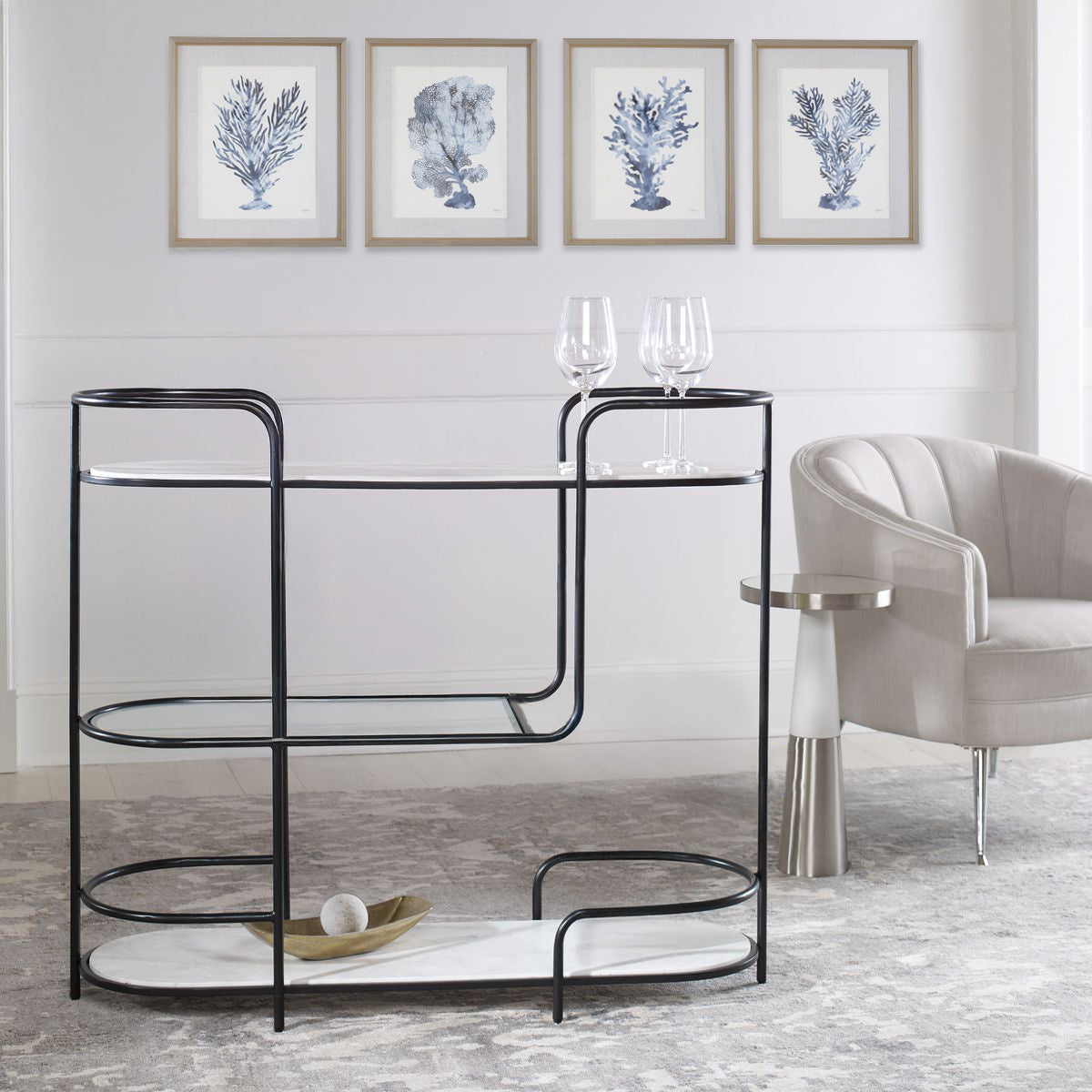 white coastal living room with black console table and silver accent table.