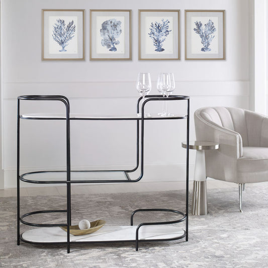 white coastal living room with black console table and silver accent table.