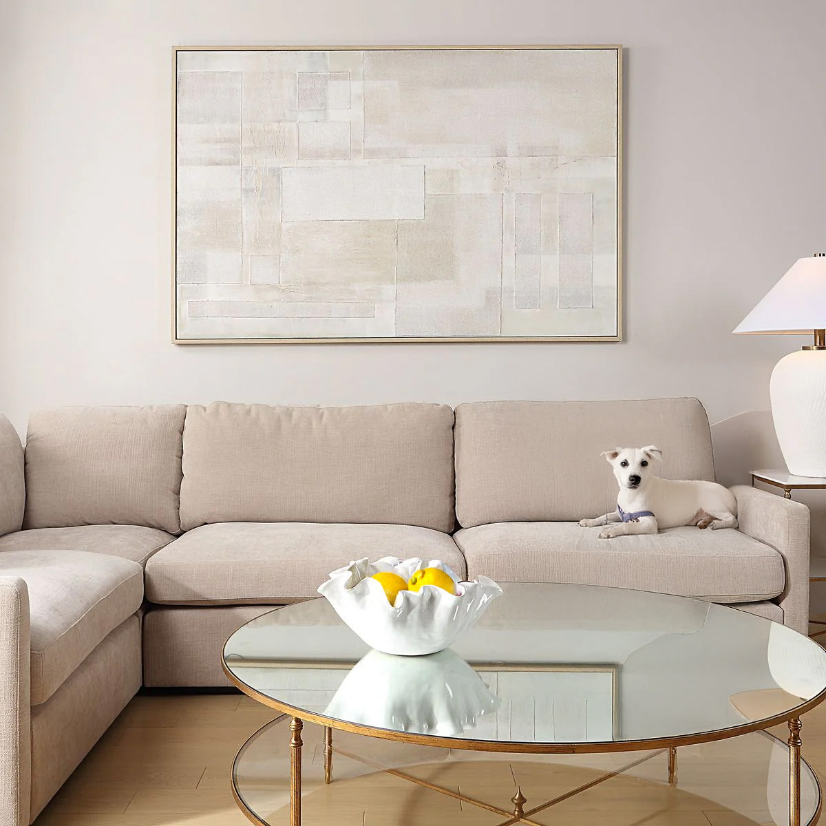 Neutral Abstract Wall Art in Living Room with Dog on Sofa.