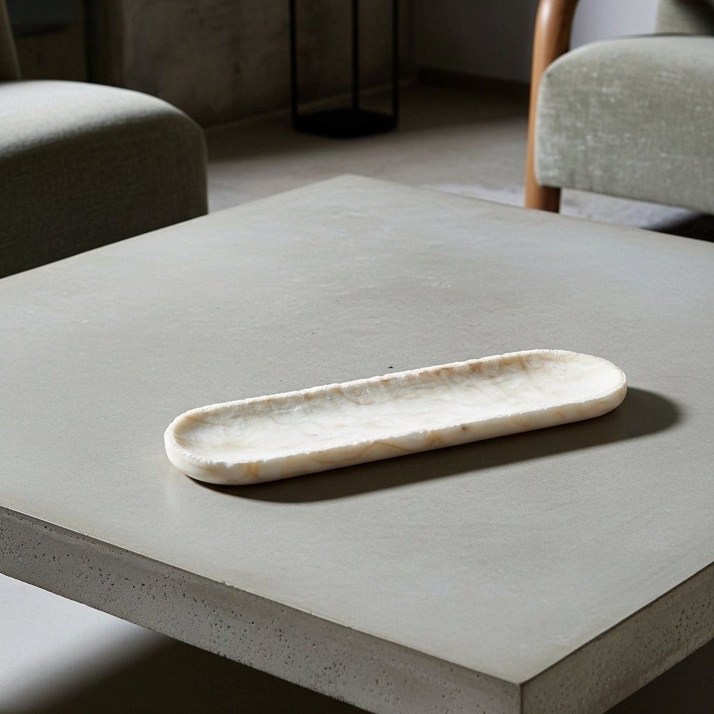 Marble tray on a concrete surface with a neutral background