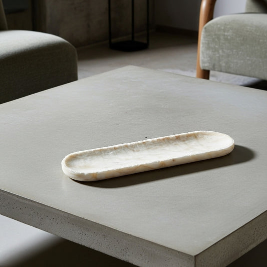 Long, narrow stone on a white background