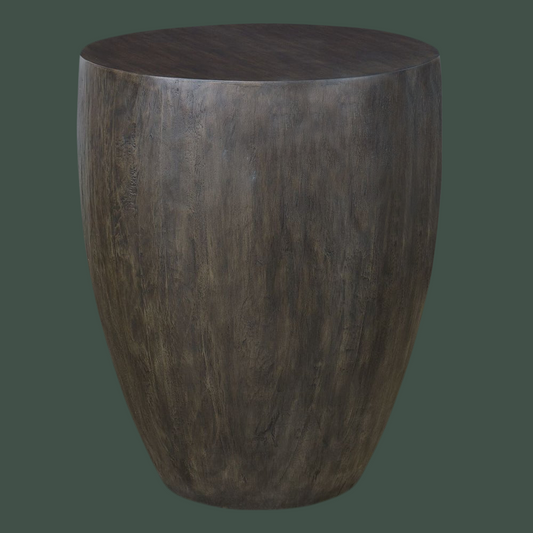 Wood drum side table on green background.