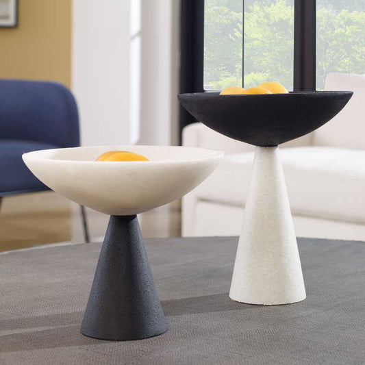 Two modern side tables, one black and white, the other white and black, on a white background.