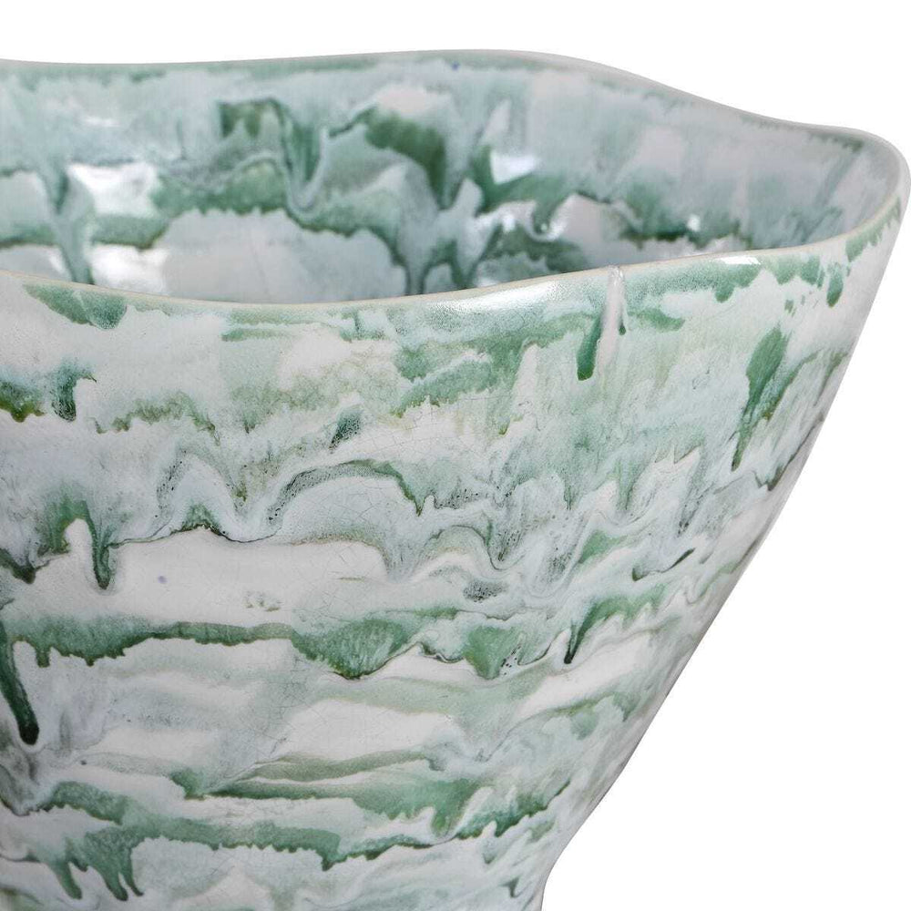 Close-up of a ceramic bowl with green and white marbled pattern