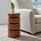 Mid-century modern accent table with white decorative boucle armchair and outdoor coastal patio.