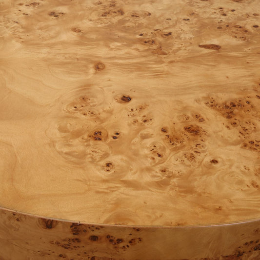 Round wooden table with burl pattern on a white background