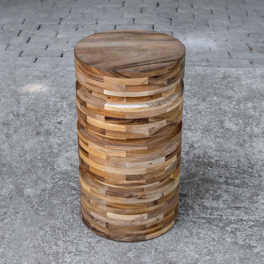 Wood Round Accent Table on Conrete.