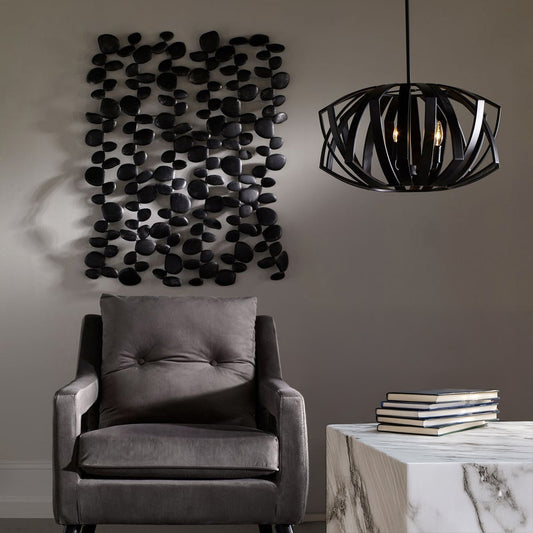 Black Metal Wall Decor with Black Chair and Chandelier.