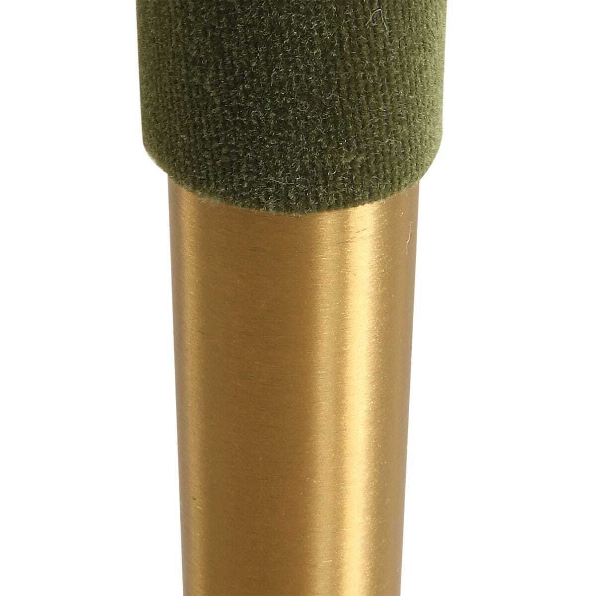 Gold cylindrical object with green foam-like top on a white background