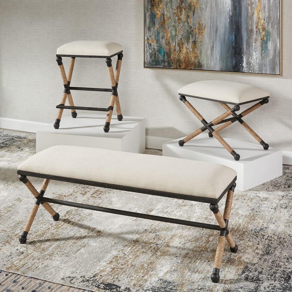 Set of three stools with metal frames and white cushioned seats in a room setting.