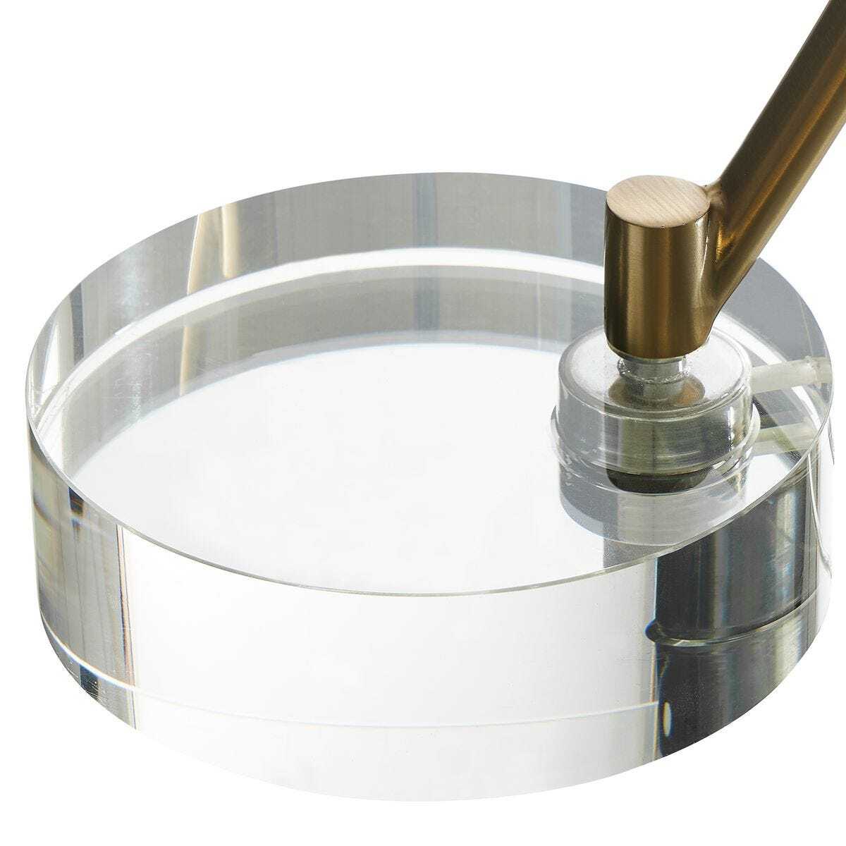 Clear magnifying glass with a gold handle on a white background