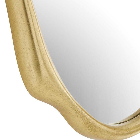 Gold-framed mirror and brown vase on a white surface with a white wall background