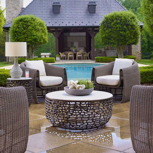 Decorative coffee table with black lattice design and white top on a white background