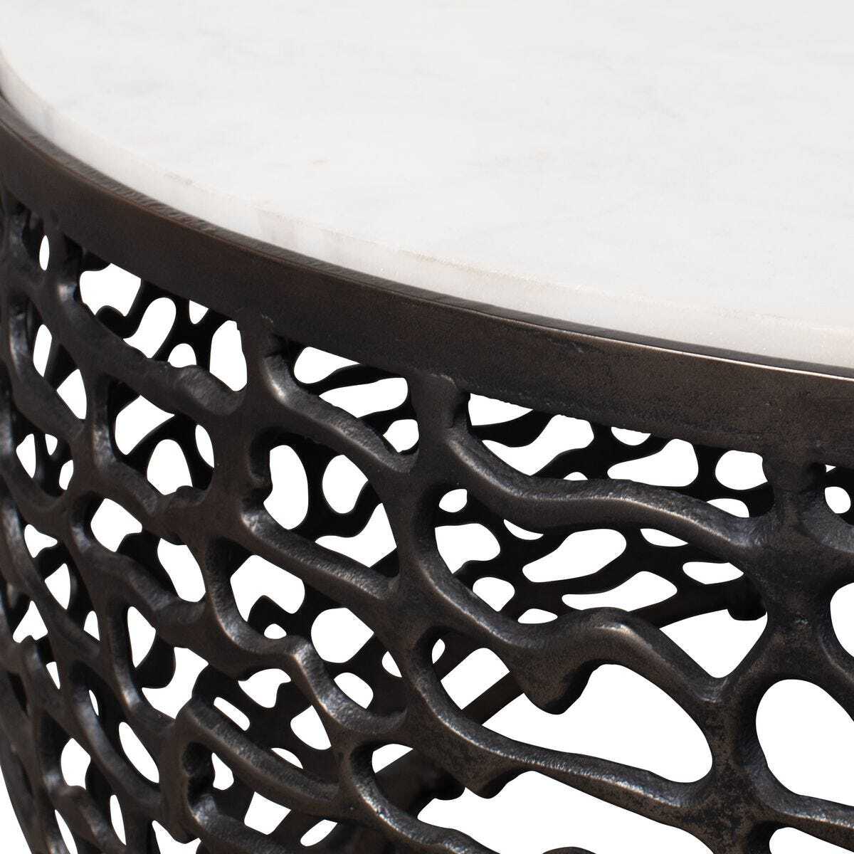 Close-up of a decorative metal stool with intricate lattice design on a white background