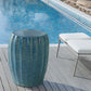 Ceramic garden stool on the patio by the pool