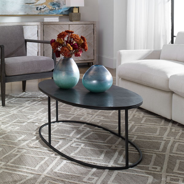 Oval metal coffee table.