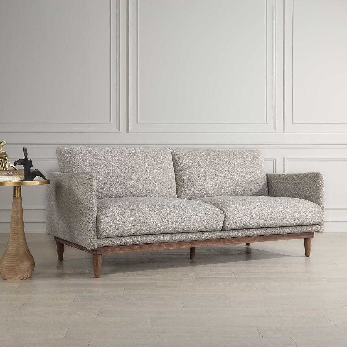 Gray sofa in a room with a neutral color scheme