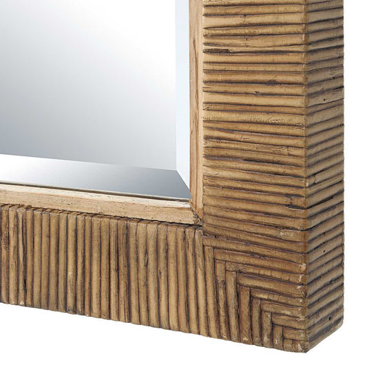 Arched mirror with wicker frame on a white background